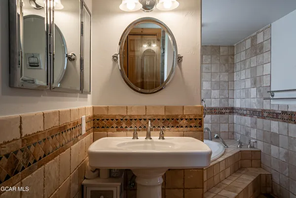 a view of a room with furniture wooden floor and windows