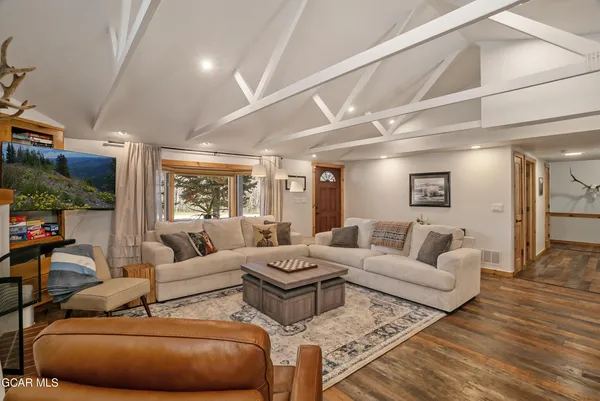 a living room with furniture a sign and a fireplace
