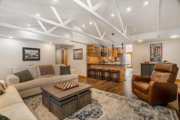 a kitchen with stainless steel appliances granite countertop a stove and a refrigerator