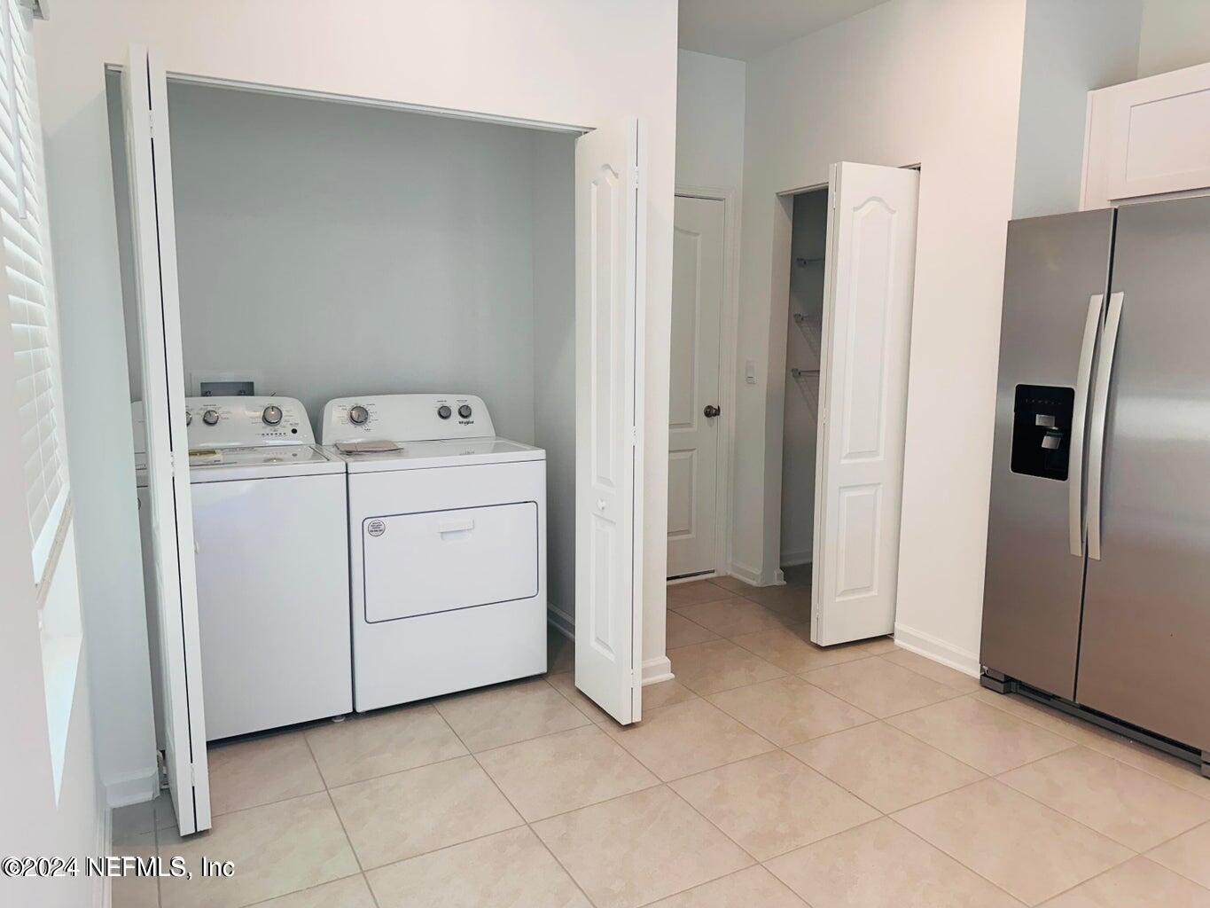 101 Tidal Bch Avenue St. Augustine, FL 32095 - Photo 2 of 13 a utility room with dryer and washer