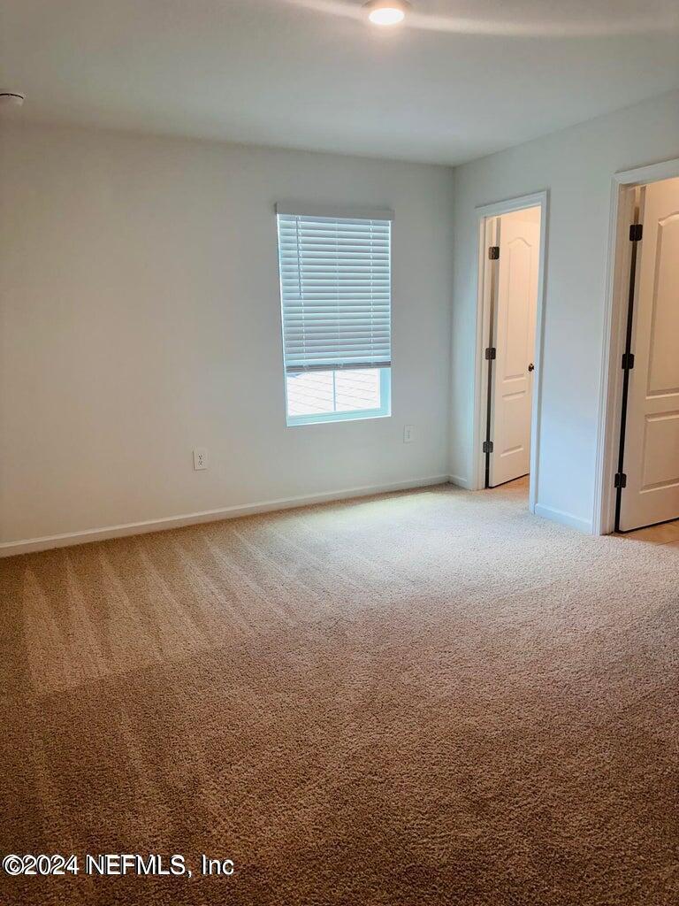 101 Tidal Bch Avenue St. Augustine, FL 32095 - Photo 5 of 13 an empty room with a window