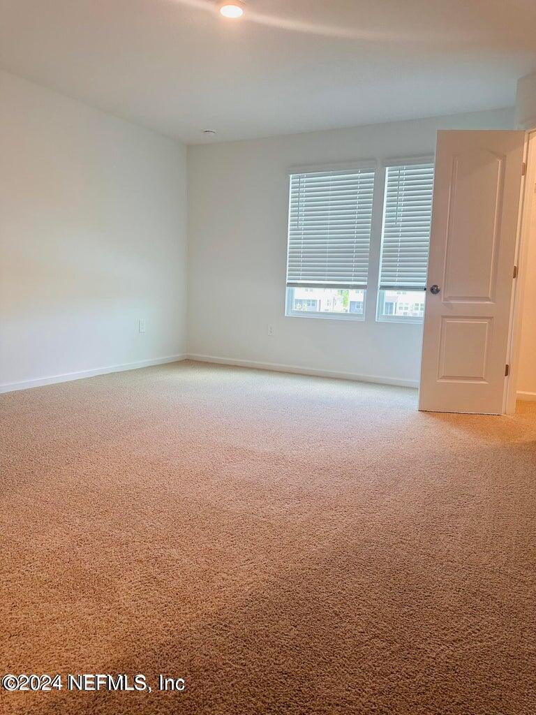 101 Tidal Bch Avenue St. Augustine, FL 32095 - Photo 10 of 13 a view of an empty room with a window