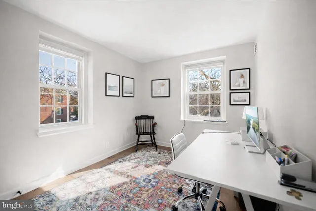 a workspace with furniture and window