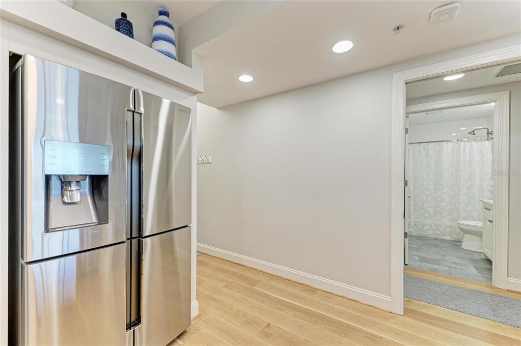3191 Matecumbe Key Road, Unit 307 Punta Gorda, FL 33955 - Photo 13 of 40 a view of a refrigerator in kitchen and an empty room