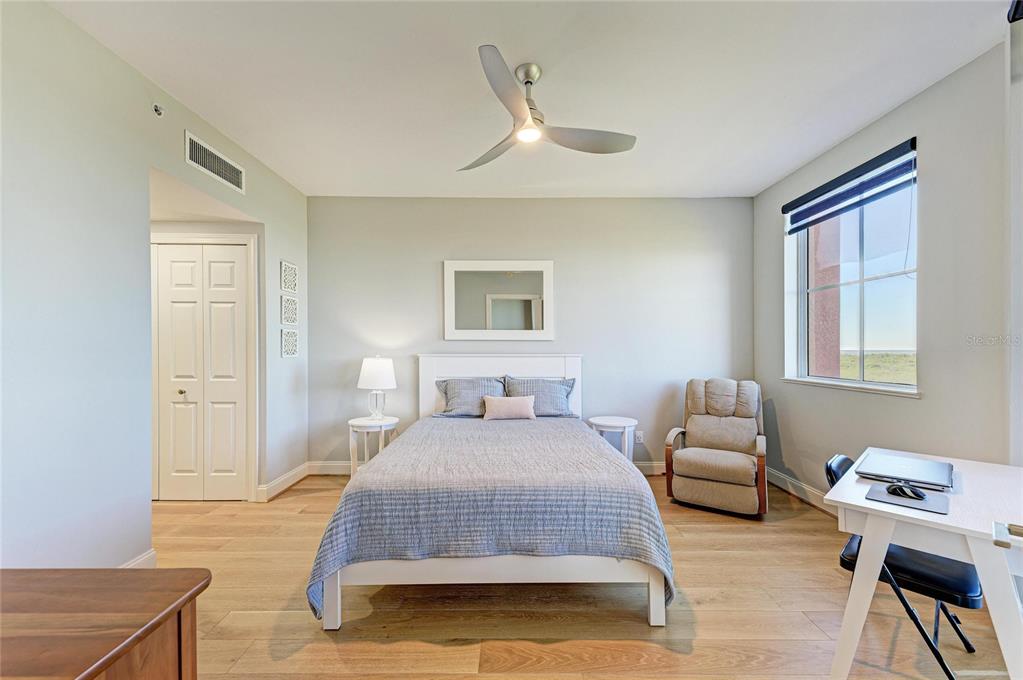 3191 Matecumbe Key Road, Unit 307 Punta Gorda, FL 33955 - Photo 14 of 40 a bedroom with a bed and wooden floor