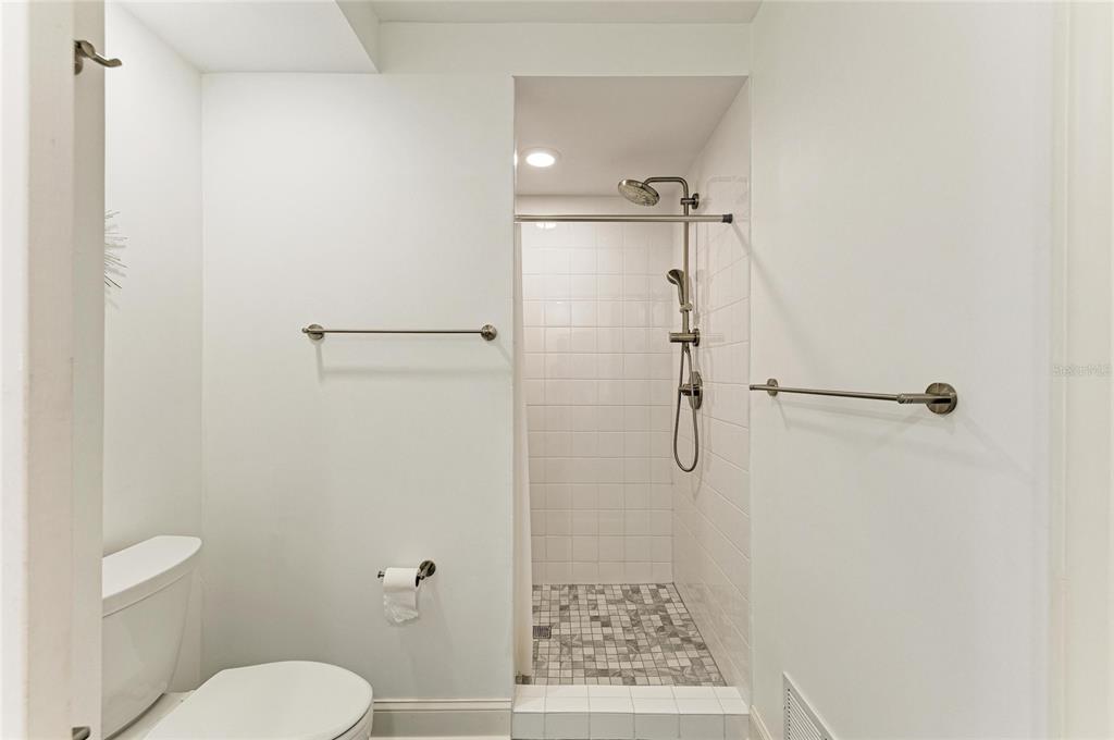 3191 Matecumbe Key Road, Unit 307 Punta Gorda, FL 33955 - Photo 20 of 40 a bathroom with a shower toilet and sink