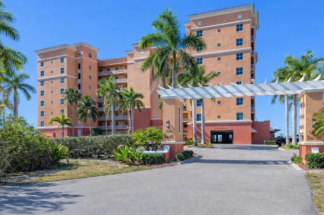 front view of a building with a garden