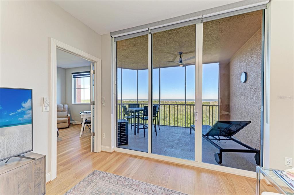 3191 Matecumbe Key Road, Unit 307 Punta Gorda, FL 33955 - Photo 25 of 40 wooden floor and windows