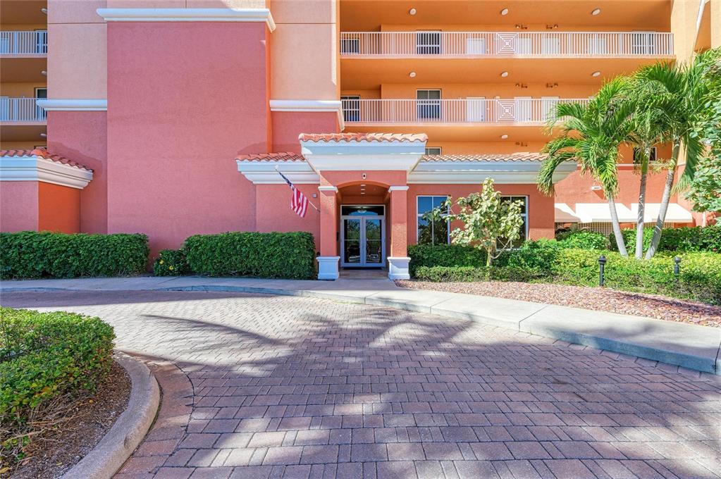 3191 Matecumbe Key Road, Unit 307 Punta Gorda, FL 33955 - Photo 30 of 40 a view of a building with a yard