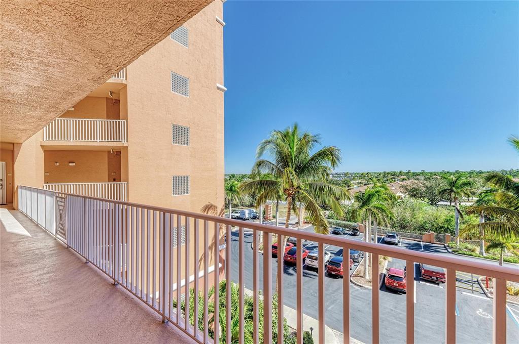 3191 Matecumbe Key Road, Unit 307 Punta Gorda, FL 33955 - Photo 32 of 40 a view of a balcony with wooden floor