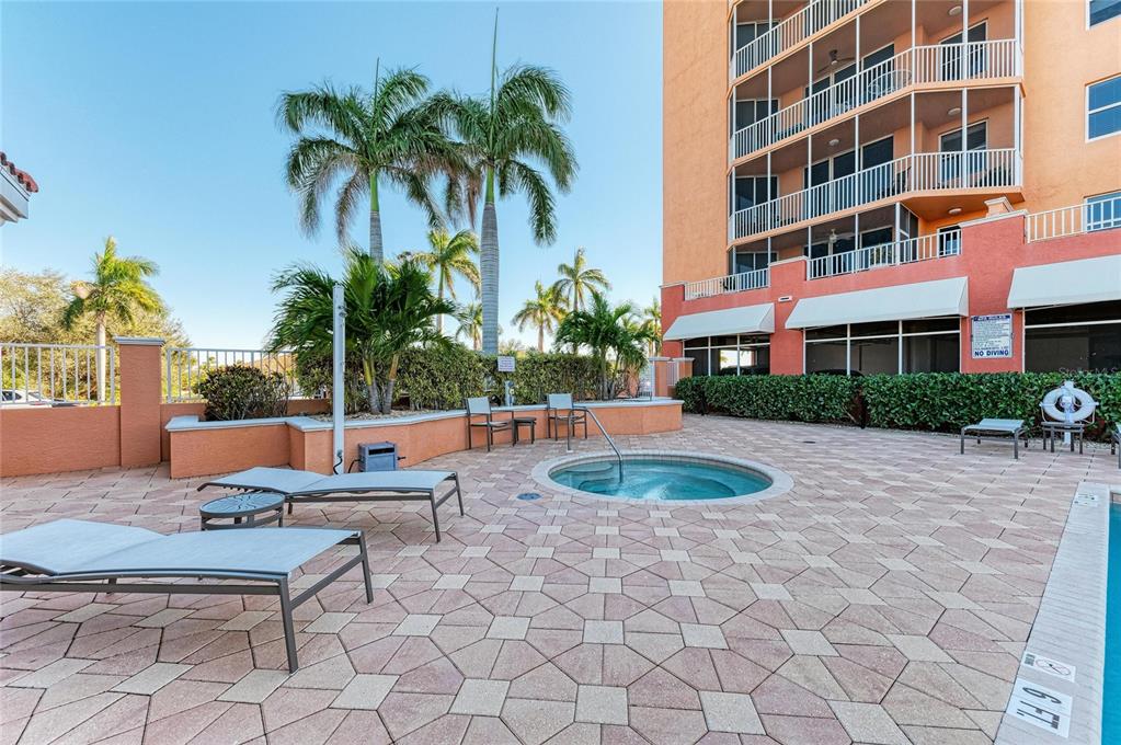 3191 Matecumbe Key Road, Unit 307 Punta Gorda, FL 33955 - Photo 35 of 40 a view of a backyard with plants and palm tree
