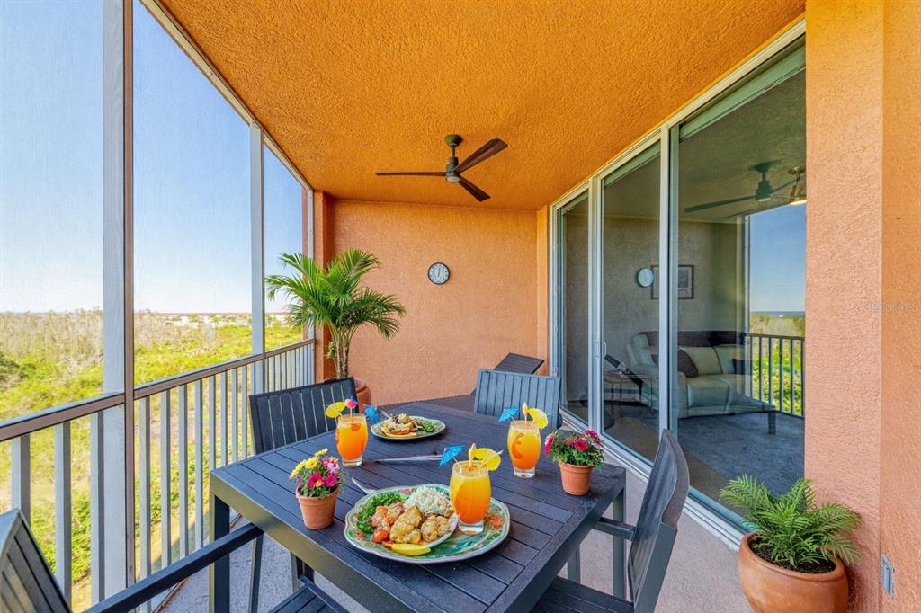 3191 Matecumbe Key Road, Unit 307 Punta Gorda, FL 33955 - Photo 37 of 40 a balcony with furniture and wooden floor