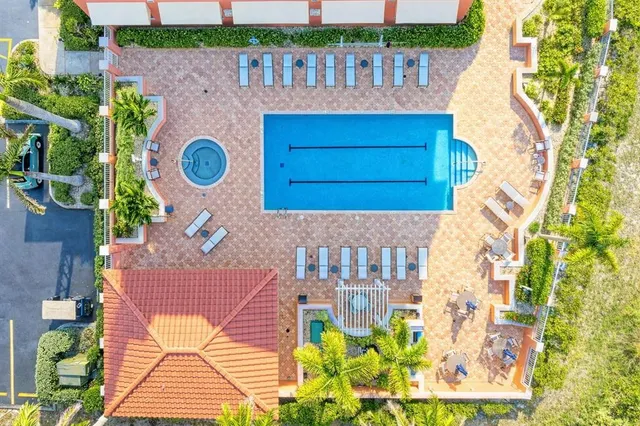 a view of a swimming pool and a chair