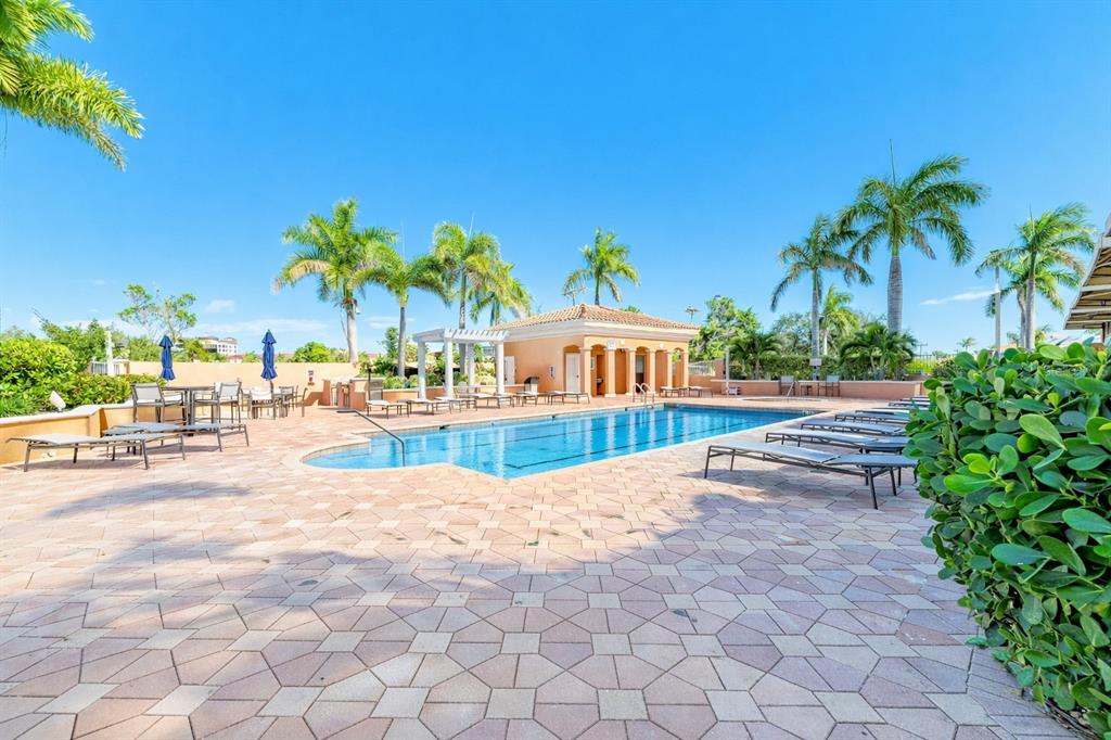 3191 Matecumbe Key Road, Unit 307 Punta Gorda, FL 33955 - Photo 39 of 40 a view of a swimming pool and a chair