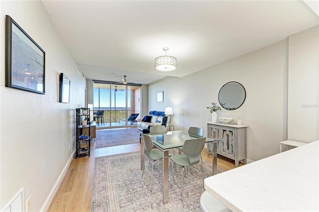 3191 Matecumbe Key Road, Unit 307 Punta Gorda, FL 33955 - Photo 6 of 40 a living room with furniture and a chandelier