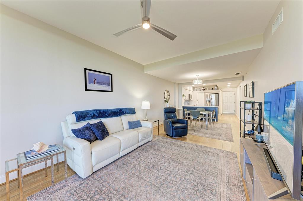 3191 Matecumbe Key Road, Unit 307 Punta Gorda, FL 33955 - Photo 7 of 40 a living room with furniture kitchen view and a chandelier