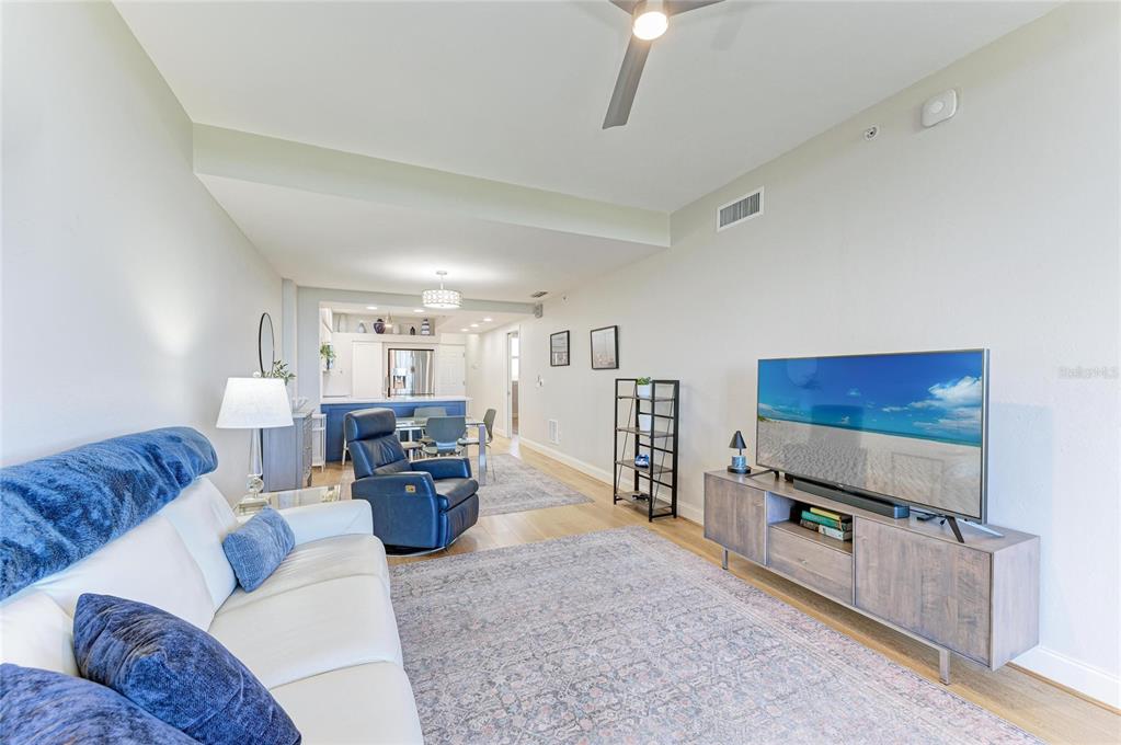 3191 Matecumbe Key Road, Unit 307 Punta Gorda, FL 33955 - Photo 8 of 40 a living room with furniture and a flat screen tv