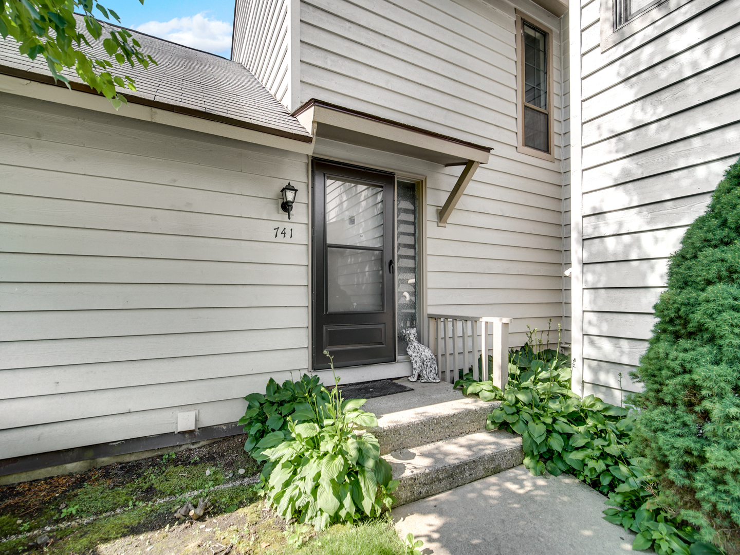 741 Colby Court Gurnee, IL 60031 - Photo 1 of 16 a side view of a house with a yard and plants