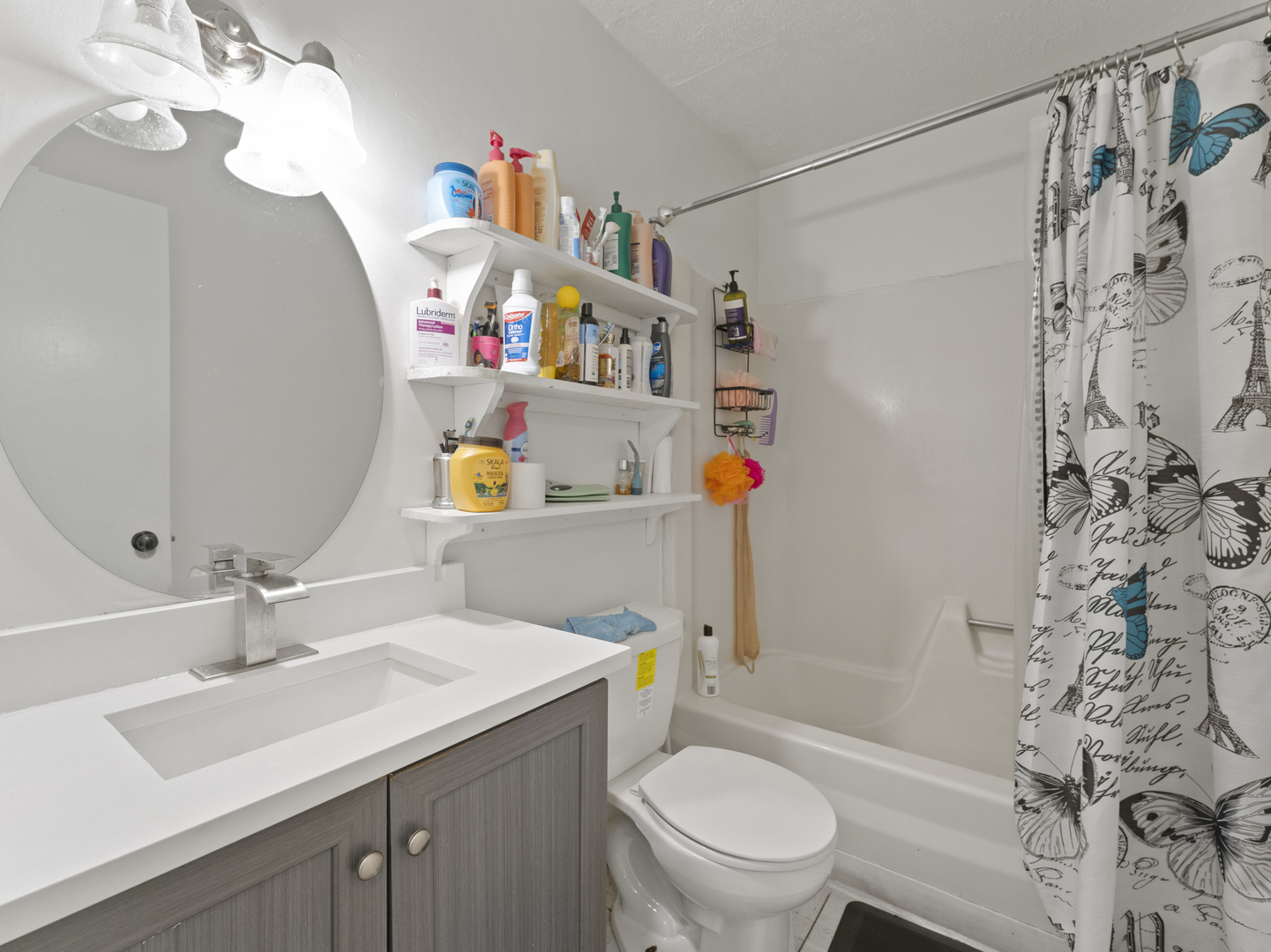 741 Colby Court Gurnee, IL 60031 - Photo 8 of 16 a bathroom with a sink a toilet and shower