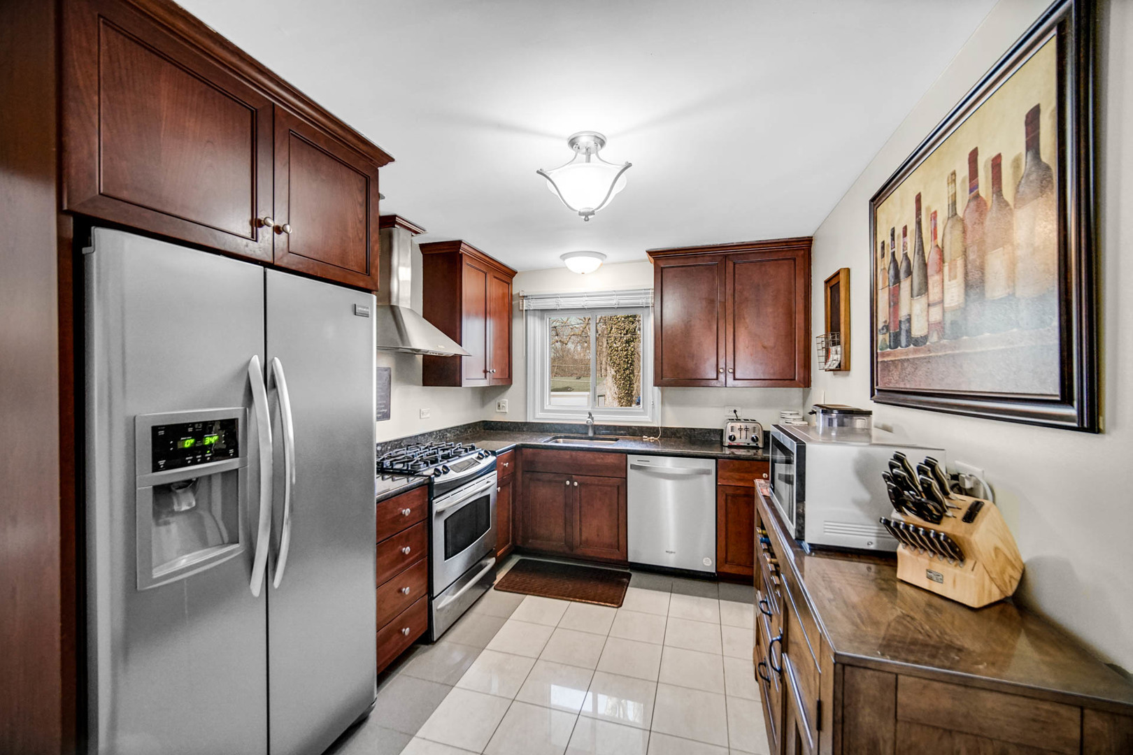 2425 Suffolk Lane Joliet, IL 60433 - Photo 11 of 24 a kitchen with stainless steel appliances granite countertop a refrigerator stove and sink