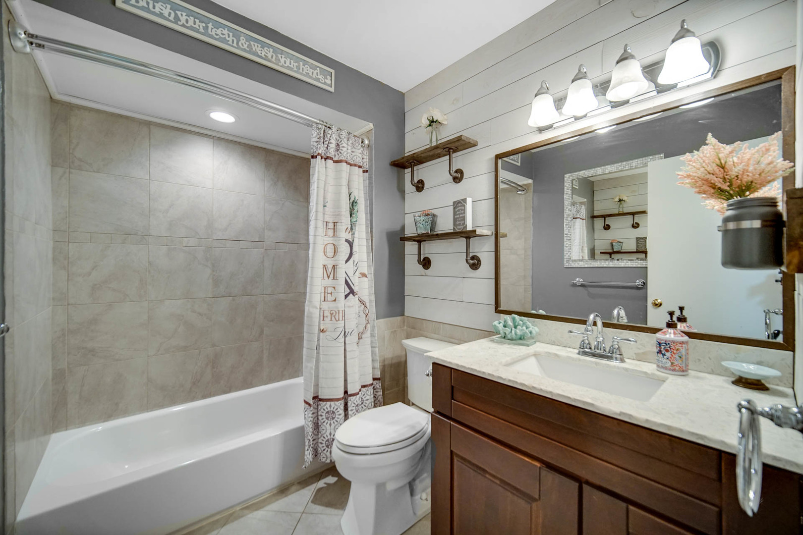 2425 Suffolk Lane Joliet, IL 60433 - Photo 13 of 24 a bathroom with a bathtub shower sink vanity and toilet