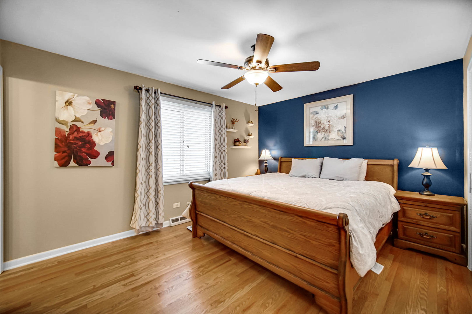 2425 Suffolk Lane Joliet, IL 60433 - Photo 14 of 24 a bedroom with a bed and a chandelier