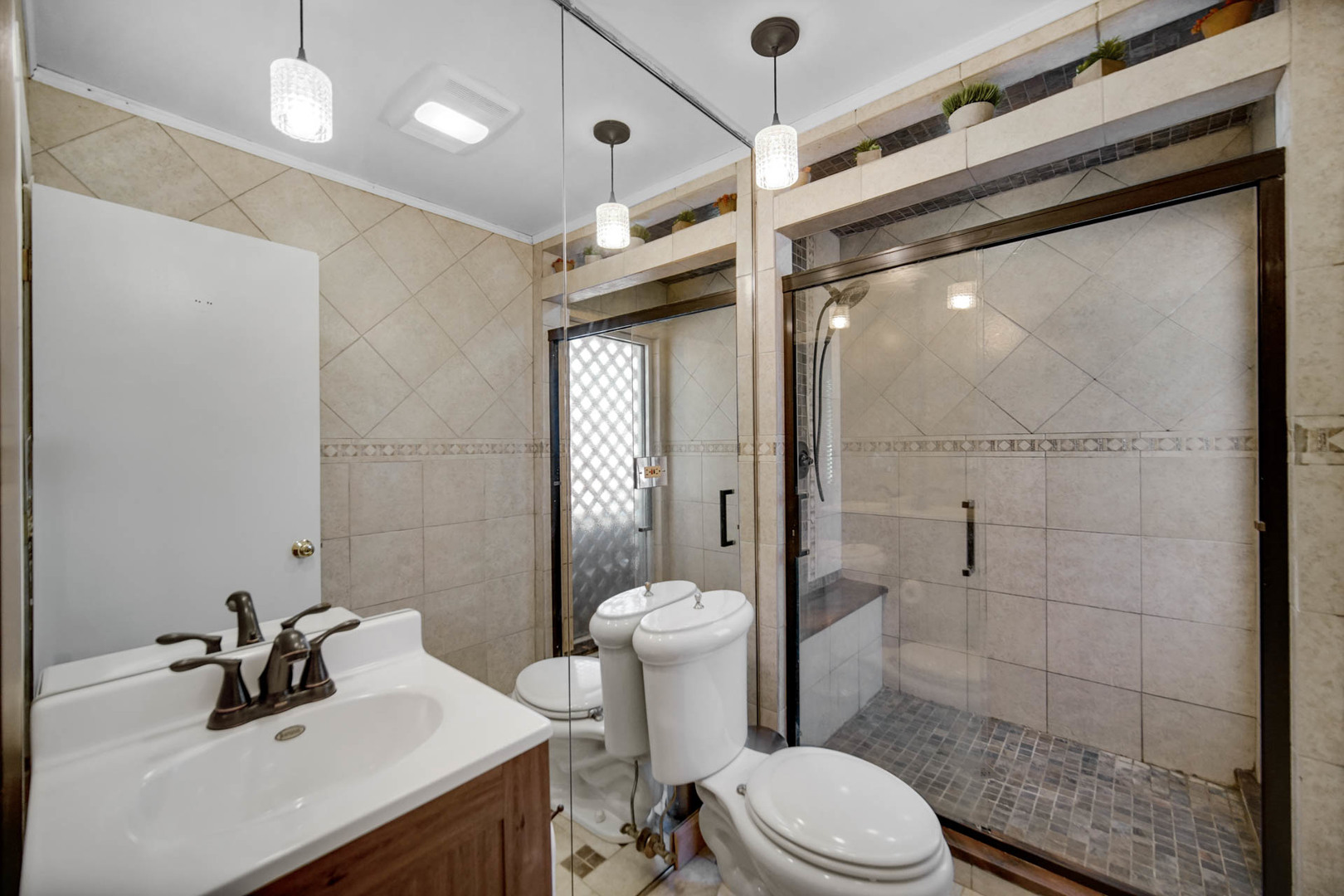 2425 Suffolk Lane Joliet, IL 60433 - Photo 15 of 24 a bathroom with a sink a toilet a mirror and shower