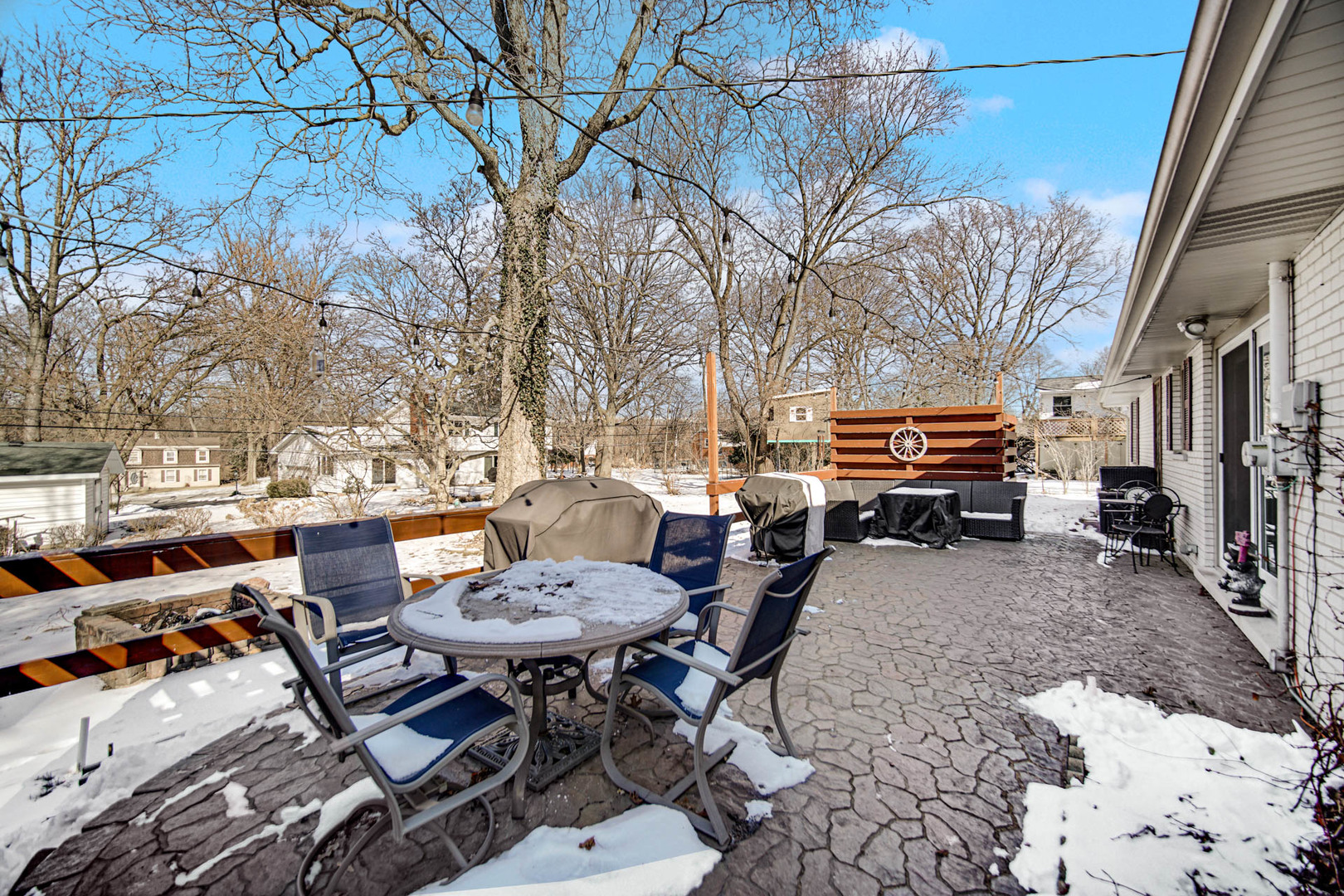 2425 Suffolk Lane Joliet, IL 60433 - Photo 22 of 24 a view of a backyard with table and chairs couches with wooden fence