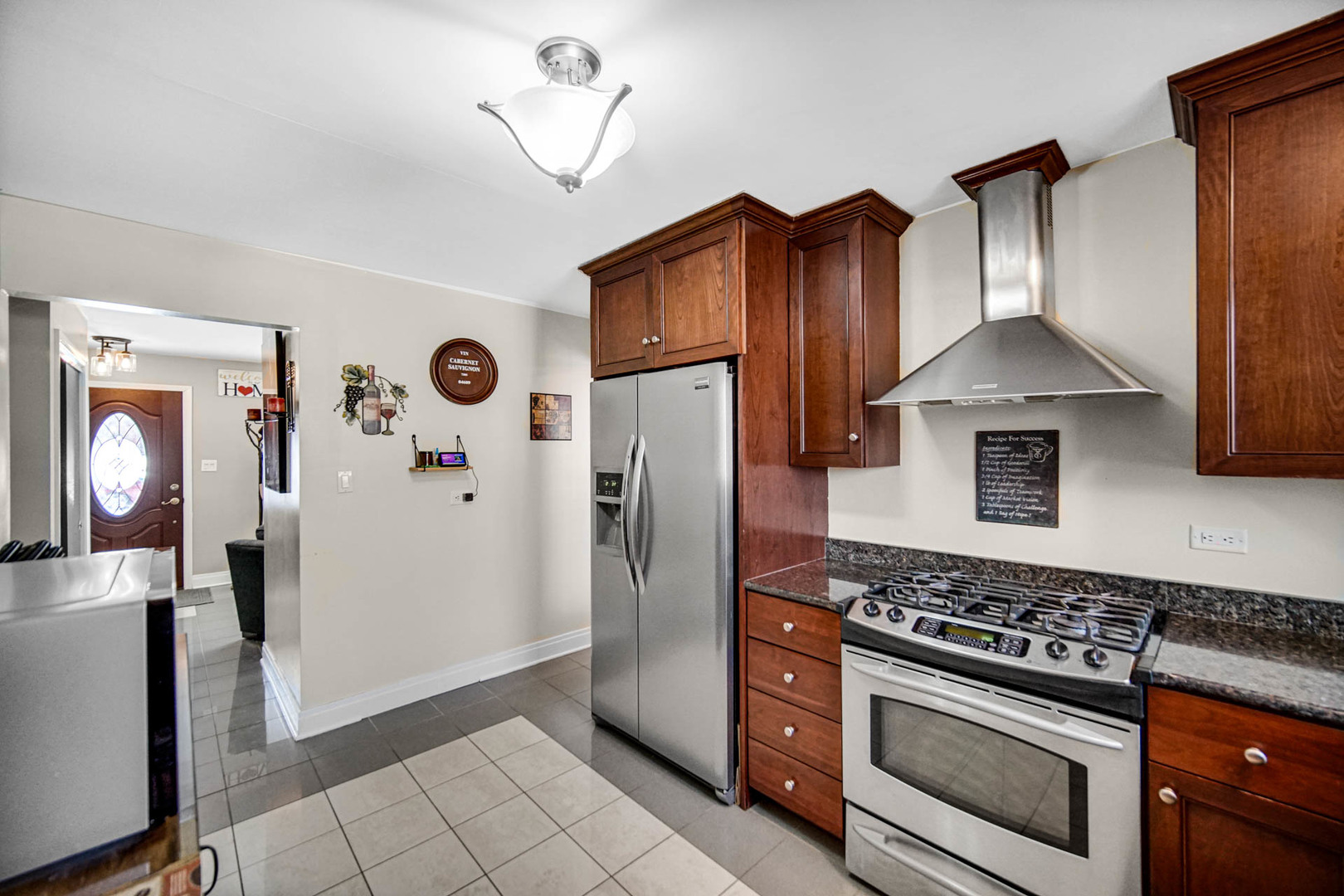2425 Suffolk Lane Joliet, IL 60433 - Photo 10 of 24 a kitchen with stainless steel appliances granite countertop a refrigerator and a stove top oven