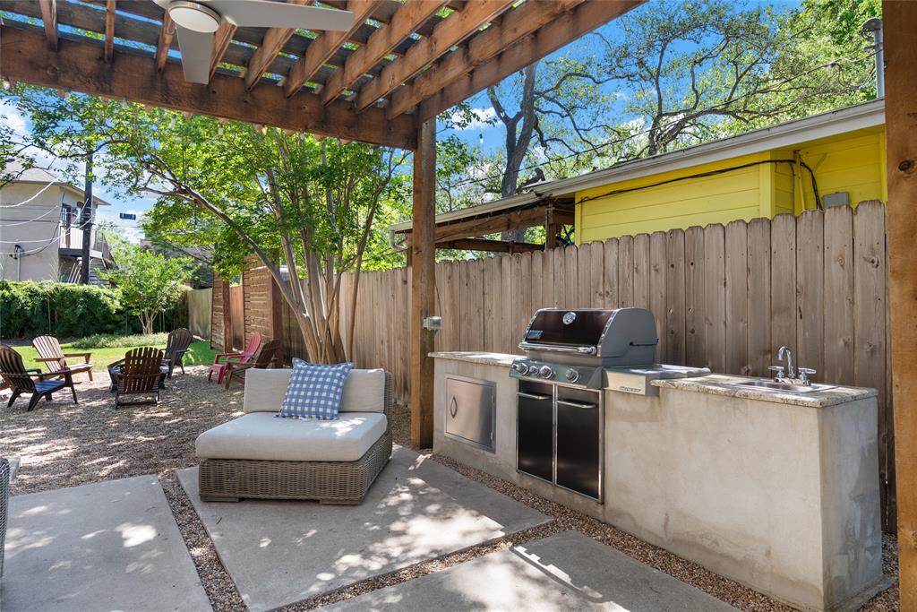 2105 Westover Road Austin, TX 78703 - Photo 17 of 19 a view of a backyard with table and chairs with a barbeque grill and plants