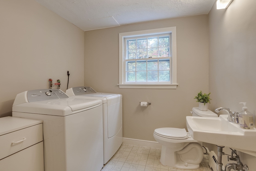 16 Fox Run Road Bedford, MA 01730 - Photo 11 of 37 a bathroom with a sink toilet and a window