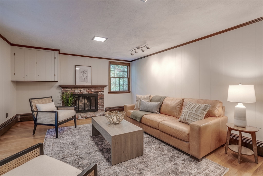 16 Fox Run Road Bedford, MA 01730 - Photo 15 of 37 a living room with furniture and a fireplace