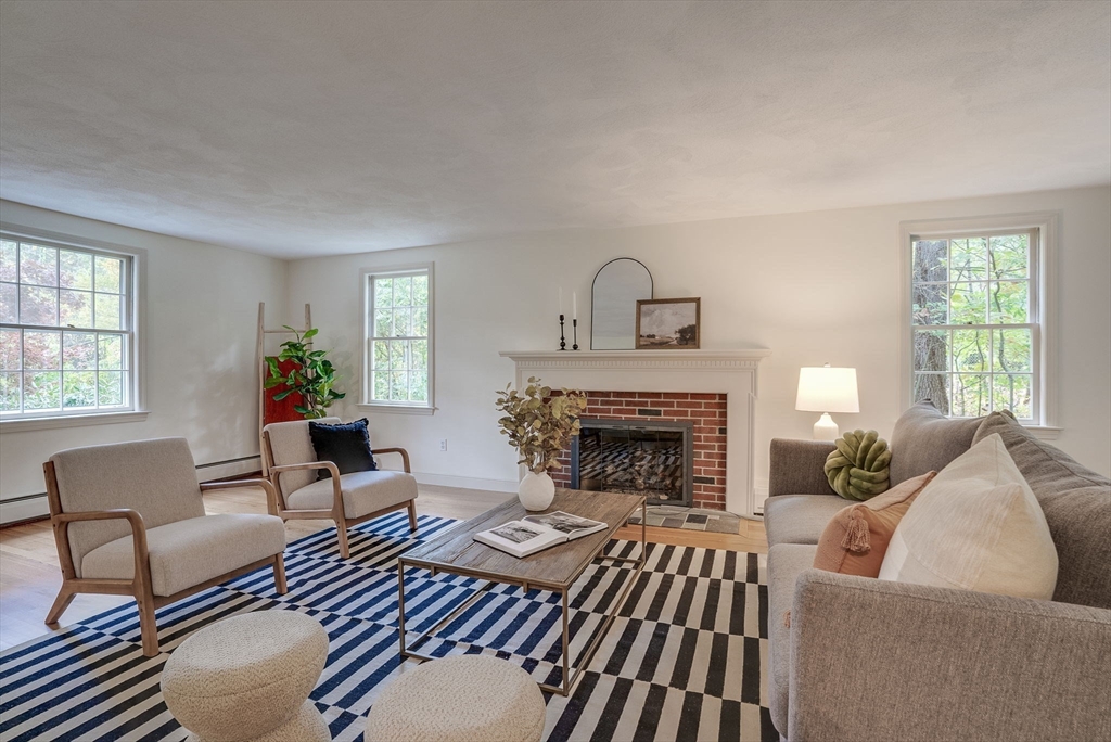 16 Fox Run Road Bedford, MA 01730 - Photo 2 of 37 a living room with furniture and a fireplace