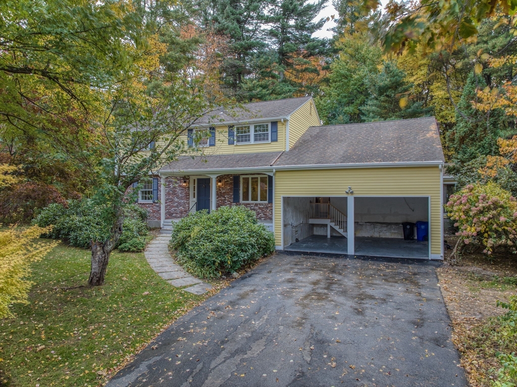 16 Fox Run Road Bedford, MA 01730 - Photo 31 of 37 a front view of a house with garden