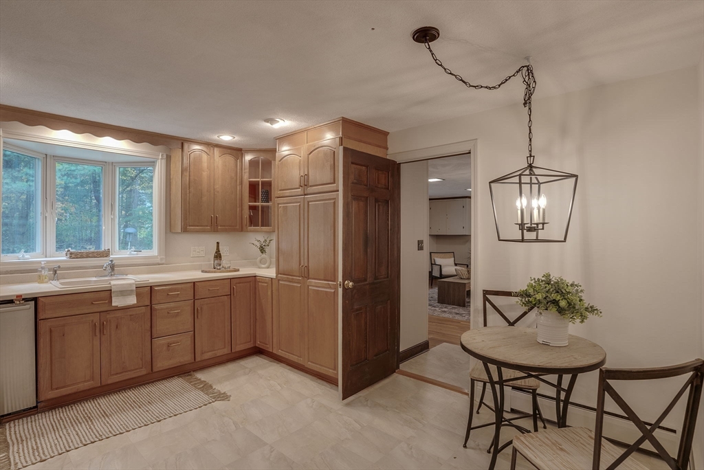 16 Fox Run Road Bedford, MA 01730 - Photo 7 of 37 a kitchen with refrigerator and cabinets