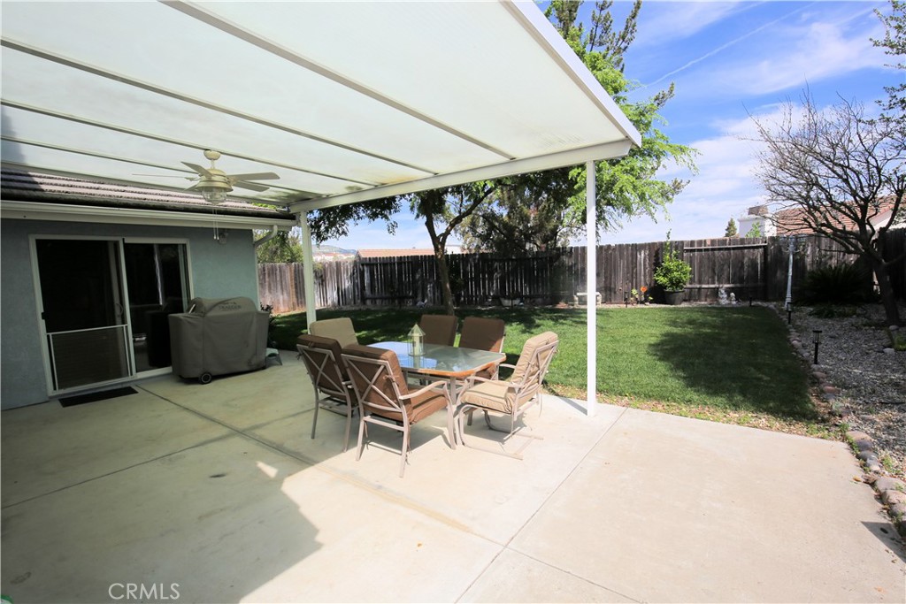 171 Bridgegate Lane Paso Robles, CA 93446 - Photo 29 of 37 a view of backyard with table and chairs under an umbrella