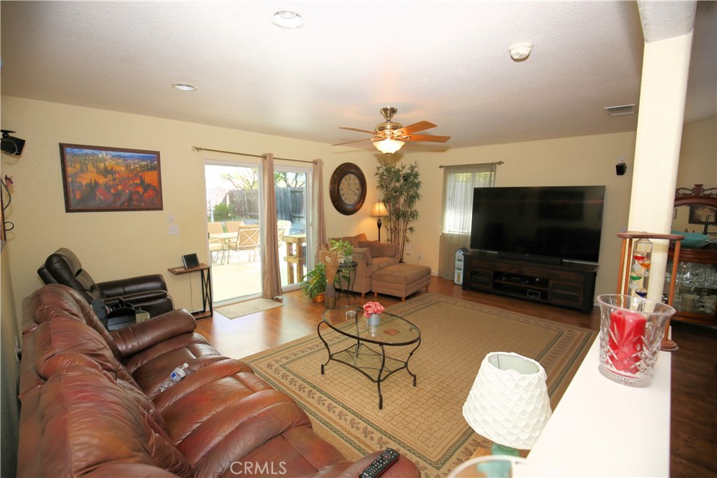 171 Bridgegate Lane Paso Robles, CA 93446 - Photo 7 of 37 a living room with furniture and a flat screen tv