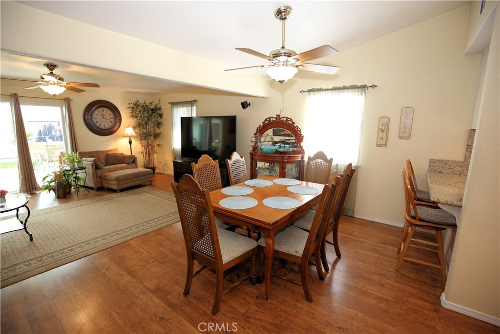 171 Bridgegate Lane Paso Robles, CA 93446 - Photo 8 of 37 a view of a dining room with furniture and wooden floor