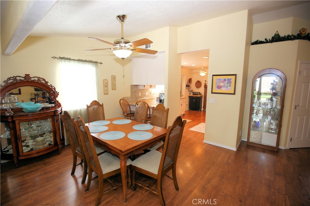 171 Bridgegate Lane Paso Robles, CA 93446 - Photo 9 of 37 a view of a dining room with furniture window and wooden floor
