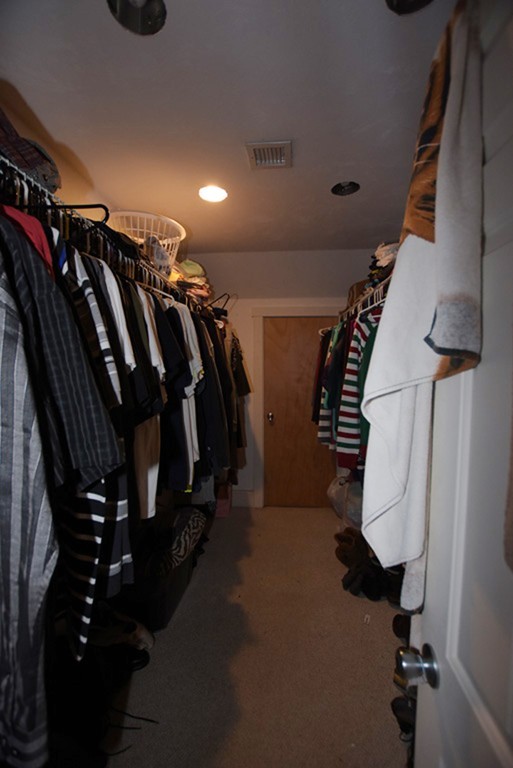 16 Shaw Road Fairhaven, MA 02719 - Photo 13 of 14 a view of walk in closet with clothes and shoes