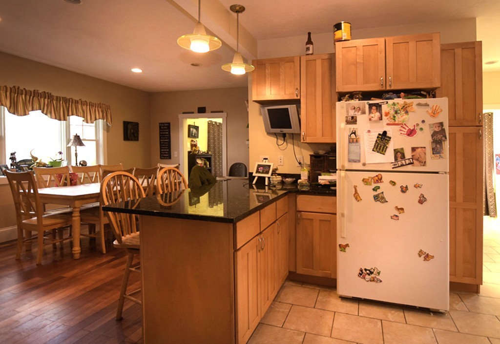 16 Shaw Road Fairhaven, MA 02719 - Photo 4 of 14 a kitchen with stainless steel appliances granite countertop a refrigerator and a stove