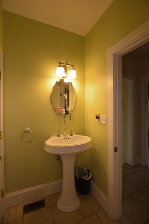 16 Shaw Road Fairhaven, MA 02719 - Photo 8 of 14 a bathroom with a sink and mirror