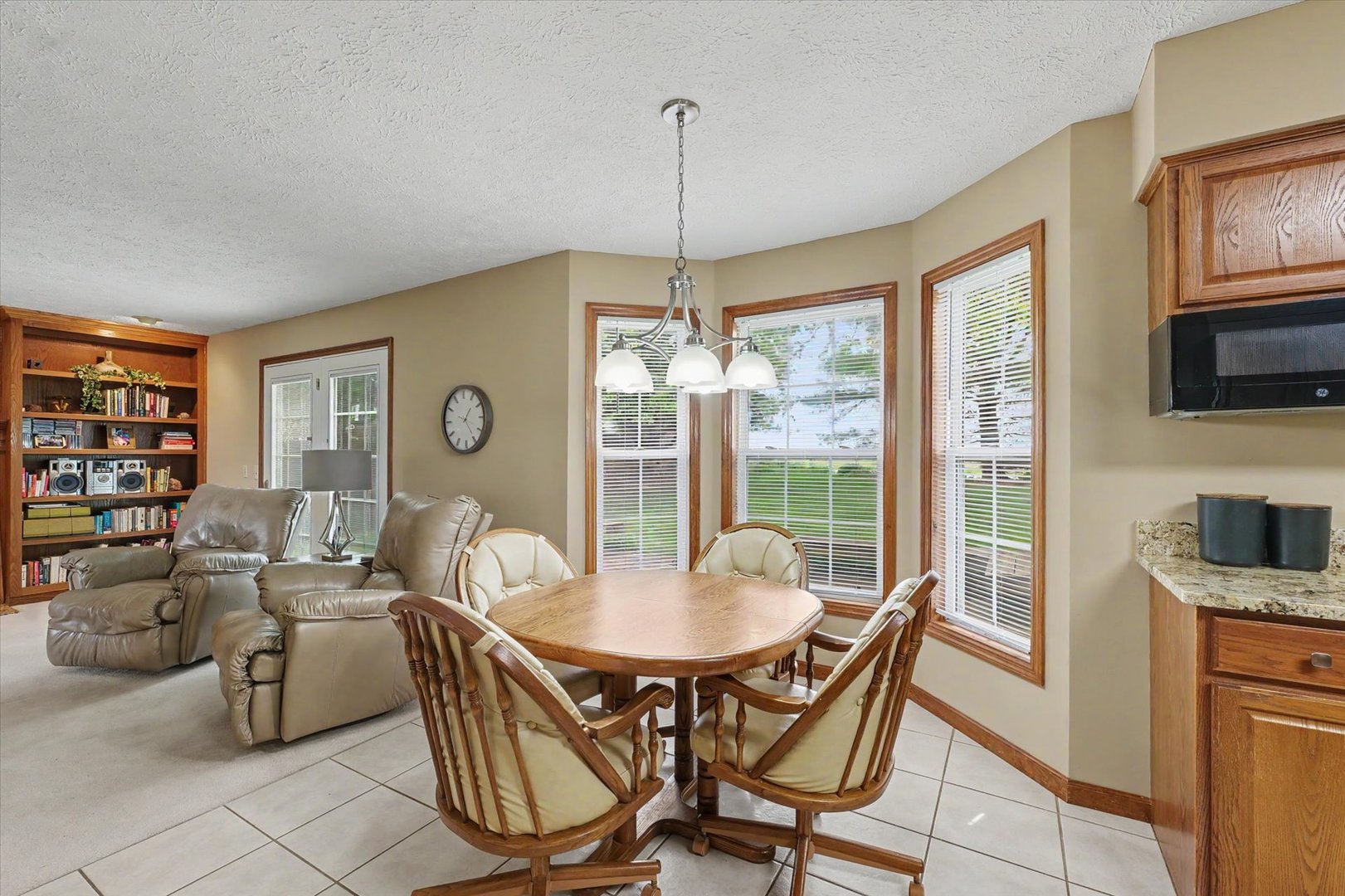 4409 Copper Ridge Road Champaign, IL 61822 - Photo 13 of 40 a dining room with furniture a chandelier and window