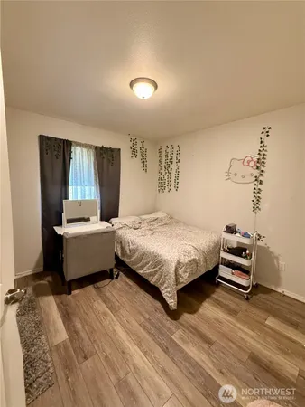 a bedroom with a bed and a couch