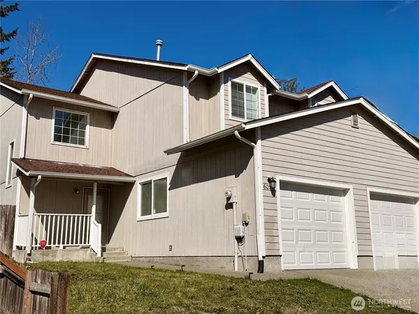 a view of a house with a garage