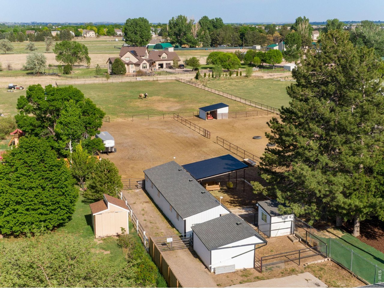 5416 South Timberline Road Fort Collins, CO 80528 - Photo 3 of 50 Barn with 2 stalls, chicken coop, loafing shed, hay storage, pasture and a large outdoor riding arena.