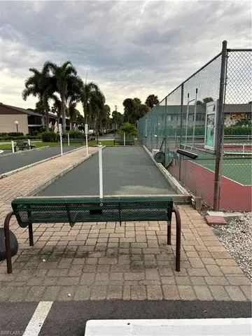 a view of a swimming pool with a patio and a yard