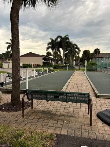 a view of a swimming pool with an outdoor seating and a yard