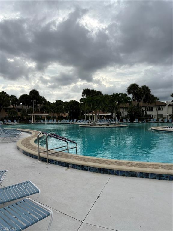 4180 Looking Glass Lane, Unit 4104 Naples, FL 34112 - Photo 21 of 30 a view of lake with green space