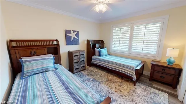 a bedroom with furniture and a wooden floor